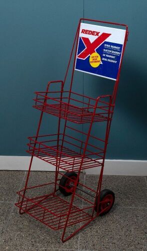 152 · REDEX: A circa 2000s three tier RedeX battery display stand on wheels with metal sign