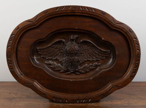 177 · PLAQUE: A carved timber wall plaque with cartouche of bald style eagle, 62cm high, 86cm wide, 7.5cm deep