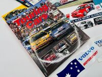 SUPER TOURING: A hardcover book, 'Touring Cars' by John Tipler together with a 3 signed photos by Peter Brock, Geoff Brabham and Jim Richards and a group of race programmes, stickers and posters [Location: Sydney]. - 2