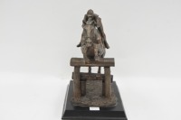 SCULPTURE: A bronze style composite sculpture of jumps jockey, on base, 23cm high - 3