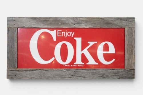 COCA COLA: A c1980s Coca-Cola sign with rustic timber surround, 55cm high, 115cm wide