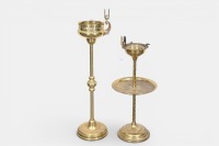 ASH TRAYS: Two c1930s brass standing ash trays with matchbox holders, tallest with cut crystal glass liner other with associated crystal liner, tallest 84cm high