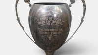 TROPHIES: A group of four cup-style trophies, three mounted to bakelite bases, the largest measures 35cm tall - 2