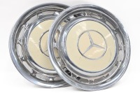 MERCEDES: Two c1960s Mercedes-Benz metal hub caps with painted white centre, diameter 38.5cm