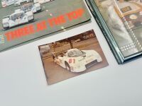 GROUP C: Six copies of 'Three at the Top', a Porsche 956 Le Mans victory brochure together with an event program for the 1988 Lucas Supersprint, the Autosport Le Mans Yearbook 1988 and a group of photos including three in frames [Location: Sydney] - 6