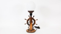 LAMP: A maritime themed lamp, with turning ships wheel to front, on wooden base, 46cm high - 2