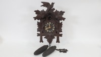 CUCKOO CLOCK: A German made timber Cuckoo clock, 40cm high
