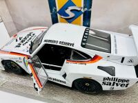 PORSCHE 935: A 1:18 scale model of the 1979 Le Mans winning Porsche 935 K3 together with a famed photo signed by Alan Jones and two posters [Location: Sydney] - 3