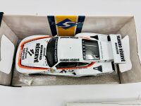 PORSCHE 935: A 1:18 scale model of the 1979 Le Mans winning Porsche 935 K3 together with a famed photo signed by Alan Jones and two posters [Location: Sydney] - 5