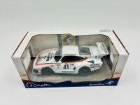 PORSCHE 935: A 1:18 scale model of the 1979 Le Mans winning Porsche 935 K3 together with a famed photo signed by Alan Jones and two posters [Location: Sydney] - 6