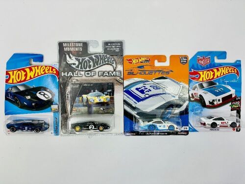 157 · HOT WHEELS: Four Hot Wheels 1:64 scale models including two of the Ford GT40 and two of the Porsche 935 [Location: Sydney]
