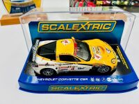CORVETTE C6R: A 1:32 scale Corvette C6R slot car by Scalextric together with a 1:64 scale Corvette C6R model by Jada/Bigtime Muscle and a hardcover book 'Modern GT Racing' by Dave Friedman [Location: Sydney] - 2