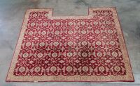 RUG: A large Persian-style rug with a cutout for a fireplace or furniture measures approx 416cm by 362cm overall