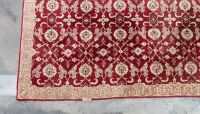 RUG: A large Persian-style rug with a cutout for a fireplace or furniture measures approx 416cm by 362cm overall - 2