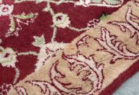 RUG: A large Persian-style rug with a cutout for a fireplace or furniture measures approx 416cm by 362cm overall - 8