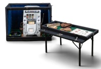 CASINO/ROLLS-ROYCE: A travelling casino kit in a Crooks trunk, includes a c1950s Silver Jubilee poker machine (with Rolls-Royce symbols) and small roulette wheel, trunk 76cm high,