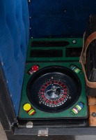 CASINO/ROLLS-ROYCE: A travelling casino kit in a Crooks trunk, includes a c1950s Silver Jubilee poker machine (with Rolls-Royce symbols) and small roulette wheel, trunk 76cm high, - 8