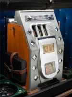 CASINO/ROLLS-ROYCE: A travelling casino kit in a Crooks trunk, includes a c1950s Silver Jubilee poker machine (with Rolls-Royce symbols) and small roulette wheel, trunk 76cm high, - 3