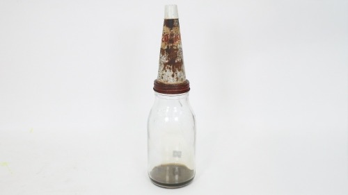 OIL BOTTLE: An original glass one litre oil bottle with tin top pourer and dust cap