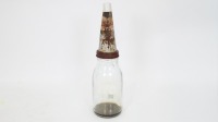 OIL BOTTLE: An original glass one litre oil bottle with tin top pourer and dust cap