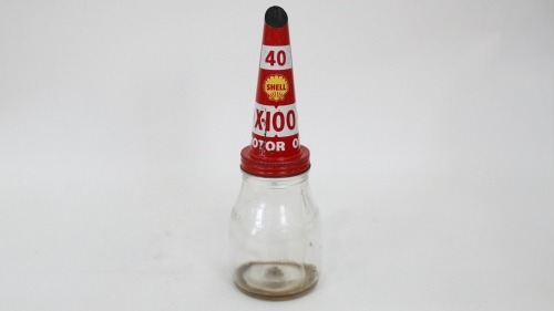 SHELL: An original Shell 'X-100' 40 weight tin top pourer on a one imperial pint glass oil bottle