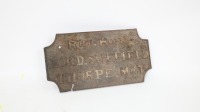 PLAQUE: A cast iron plaque reading 'Rht Hon Lord Suffield Thorpe Mkt', measures 16cm high, 31cm wide