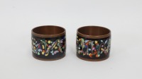 NAPKIN RINGS: A pair of brass and enameled napkin rings, believed to be of Japanese origin, approx 4cm each in diameter