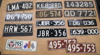 NUMBER PLATES: A collection of number plates, includes a Targa Tasmania competitors plate, numerous Victorian white on black plates and some silver on black UK plates