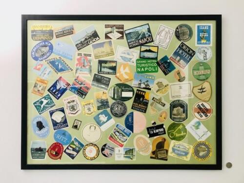 HOTEL STICKERS: circa 1920's onwards, framed 109cm wide by 84cm tall, with 85 additional stickers in envelope.