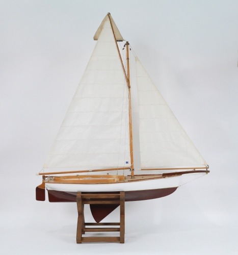 POND YACHT: A wooden pond yacht model on timber base, overall height 110cm