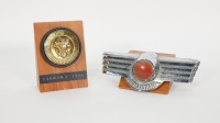 CAR BADGES: Two British make badges mounted on timber displays, includes a Jaguar 'E' Type badge and a Morris badge