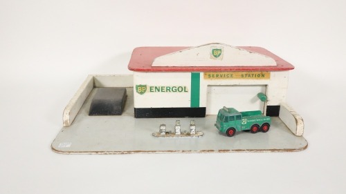 BP: A c1960s-1970s BP Energol timber children's service station, features opening garage door, petrol pumps in forecourt and comes with Matchbox King Size BP Service Foden truck