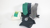 BP: A group of BP branded clothing items, includes neck ties, socks and a hat