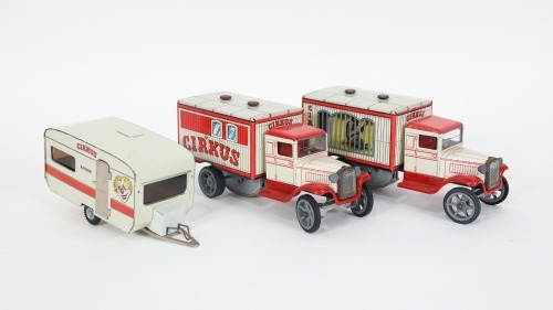 TIN TOYS: Three modern tin toy circus transport vehicles, includes two vans, 18cm long and one caravan, 16cm long