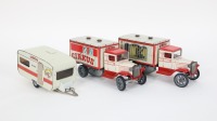 TIN TOYS: Three modern tin toy circus transport vehicles, includes two vans, 18cm long and one caravan, 16cm long