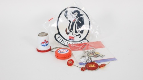 PETROLEUM: A group of petroleum-related items, including two Esso keyrings, an Amoco coin holder, an Ampol VFL Magpies sticker, and others