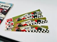 MCLAREN: A framed print of Niki Lauda and his MP4/2 together with four stickers and a copy of 'Kimberley' Grand Prix Team Guide No.5; McLaren' by Bob Constanduros [Location: Sydney] - 3