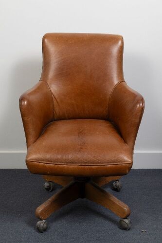 CHAIR: A circa 1940s gentleman's leather spring loaded desk chair, 90cm high, 60cm wide