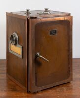 HUMIDOR: A large copper bound cigar humidor safe, with manufacturer's plate on front 'Ergos' with safe door style mechanism