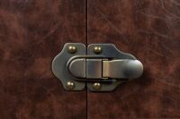 WARDROBE: A large upright faux steamer trunk storage wardrobe, with bi-folding front section on castors, 153cm high, 79cm wide, 69cm deep - 6