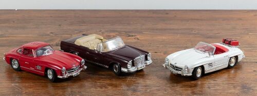 MERCEDES: Three 1:18 scale Burago models of 300SL roadsters and 1966 280 SE Cab,