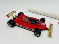 FERRARI: A 1:18 scale Bburago model of the 312 T4 and a 1:43 scale model of the 312T together with a Michele Albereto poster [Location: Sydney] - 2