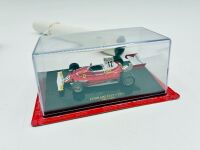 FERRARI: A 1:18 scale Bburago model of the 312 T4 and a 1:43 scale model of the 312T together with a Michele Albereto poster [Location: Sydney] - 4