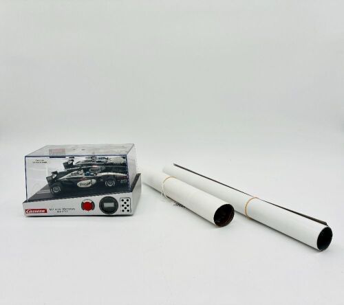 185 · MCLAREN: A 1:24 scale MP4/17 alarm clock by Carrera, together with two McLaren posters [Location: Sydney]