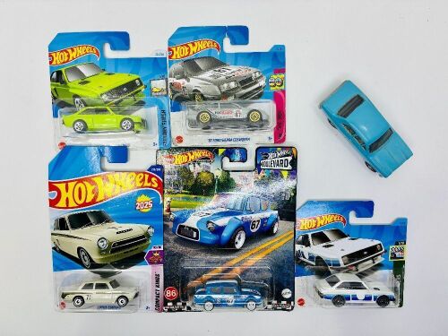 188 · FAST FORDS: Five 1:64 scale Hot Wheels models featuring two Escorts, a Cortina, an Anglia and a Sierra together with a 1:43 scale MK1 Escort by Corgi [Location: Sydney]