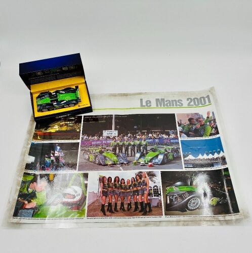 MG LOLA: A 1:32 scale slot car by Scalextric of the MG Lola EX257 together with poster [Location: Sydney]