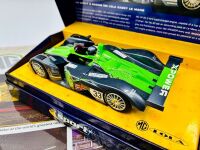 MG LOLA: A 1:32 scale slot car by Scalextric of the MG Lola EX257 together with poster [Location: Sydney] - 4