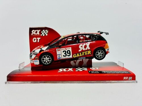 SEAT: A 1:32 scale Seat Leon Supercopa slot car by SCX with original display case [Location: Sydney]