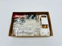 FORD SIERRA: A 1:24 scale model kit of the Ford Sierra RS500 Group A by Tamiya [Location: Sydney] - 2