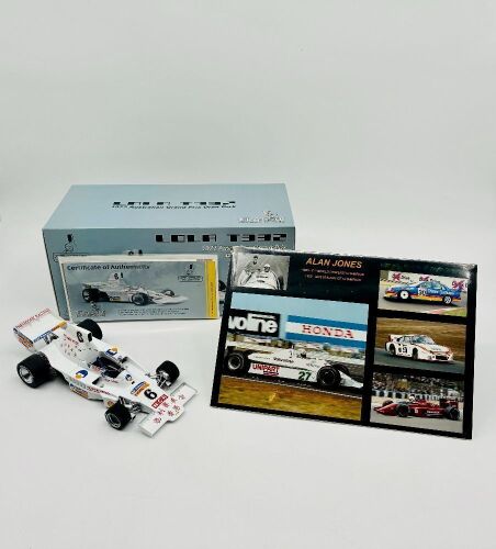 174a · ALAN JONES: A 1:18 scale model by Classic Carlectables of the Lola T332 driven by Alan Jones, complete with certificate of authenticity and and original packaging together with an unwrapped group of photos mounted on card [Location: Sydney]